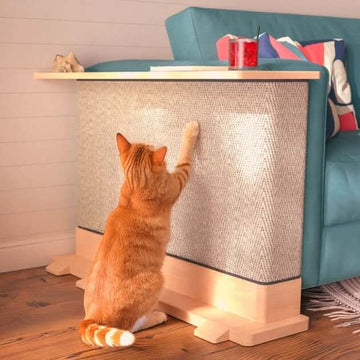 Do cats scratch leather couches: orange tabby cat scratching the sisal side of a Maple-finish CozeCat Side Table beside a teal sofa